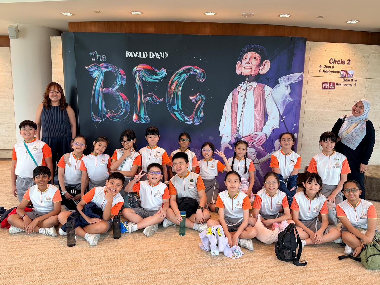 A group of students posing in front of the sign for Roald Dahl's The BFG